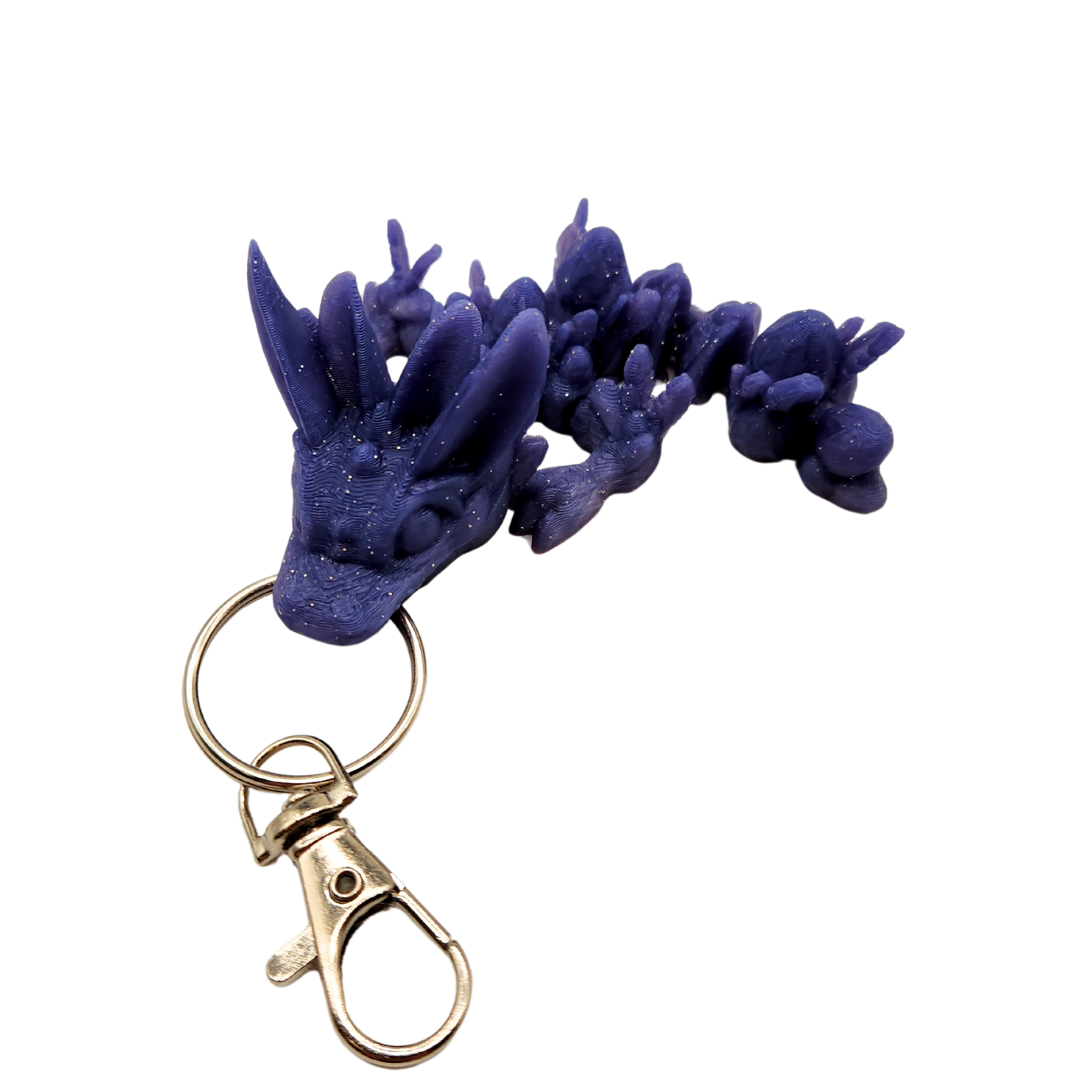 Ein Drachen Schlüssel Anhänger in der Oster Variante.
